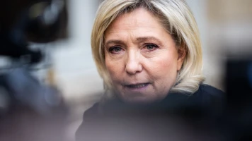 La présidente du Rassemblement National critique le président à l'événement