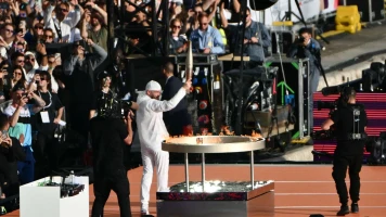 Réception de la torche olympique par Nantenin Keïta et Florent Manadou