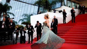 Arnaud Assoumani porte la flamme olympique au Festival de Cannes 2021