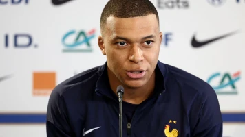 Conférence de Presse à Düsseldorf: Chef d'Équipe Français Défend Principes