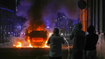 Violences à Ballymena : Émeutes et conflits communautaires suite à une manifestation